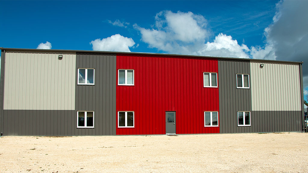 U-Build Aesthetic appeal is often considered for shops which include office space. This office space is built along the side of a steel cladded farm maintenance shop.
