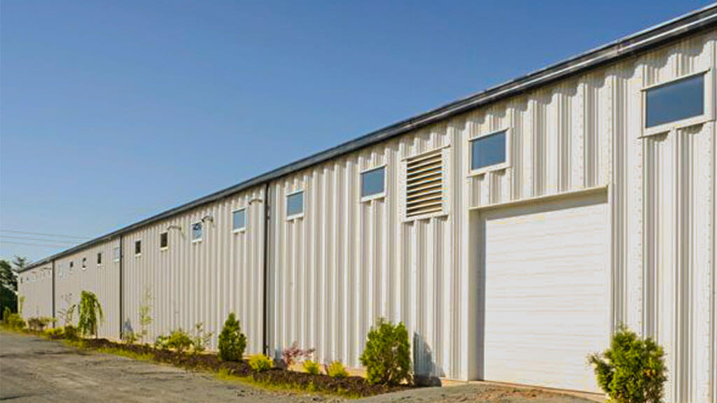 U-Build Equestrian facilities of any shape and size can be manufactured with U-Build. This is an exterior shot of a relatively large riding arena.